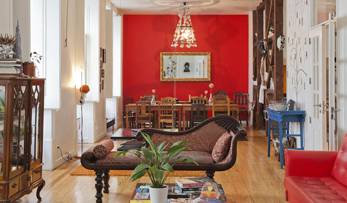 Common area with eclectic mix of furniture at Living Lounge Hostel, Lisbon