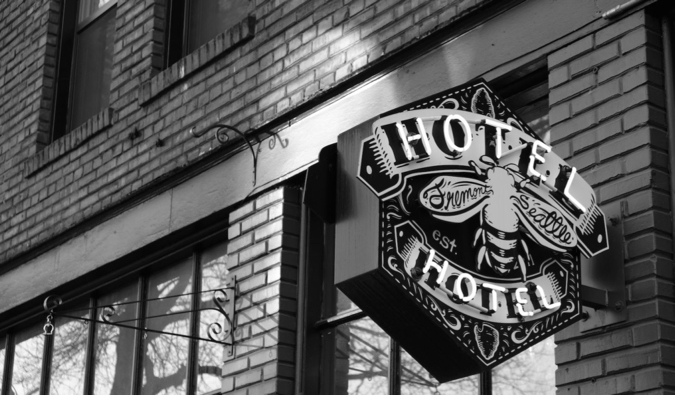 A black and white photo of the exterior of the HotelHotel hostel in Seattle