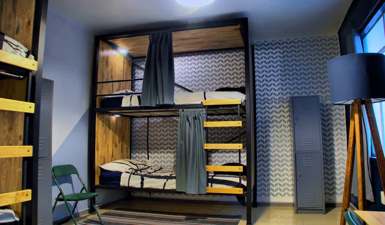 米odern wood bunk beds in dorm room at Wanderlust District in Mexico City