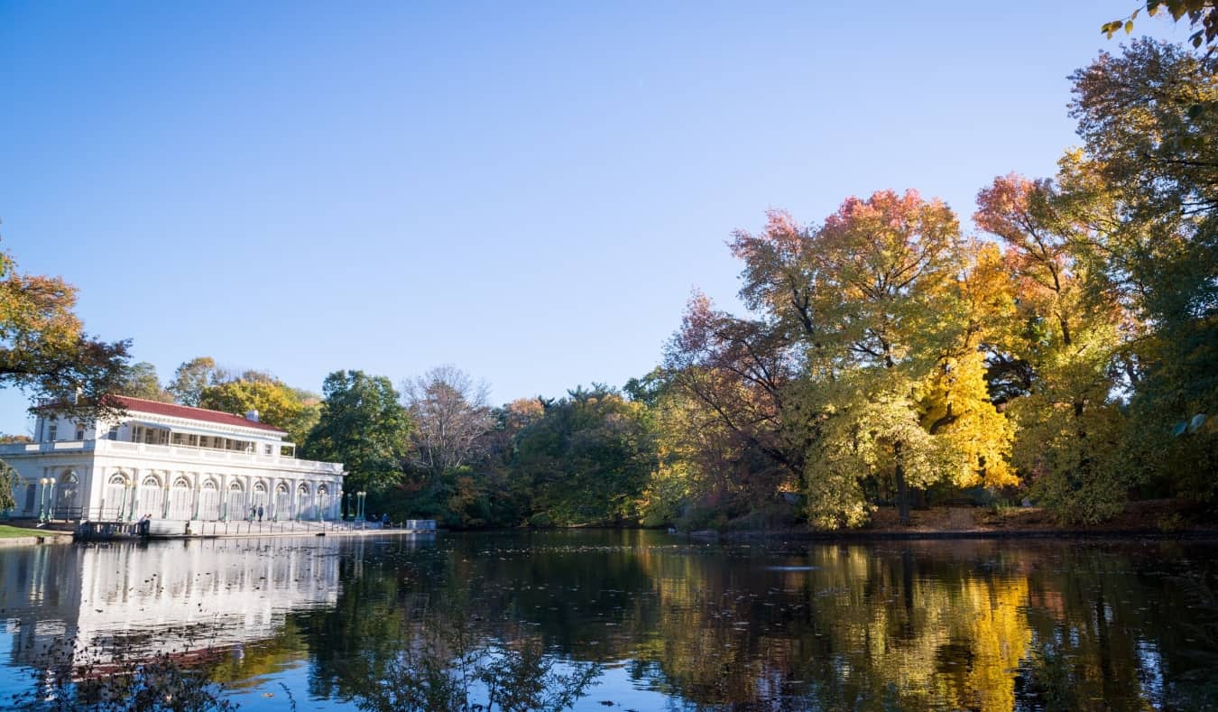 The calm waters in Prospect Park reflecting one of the old buildings in Brooklyn, NYC, USA