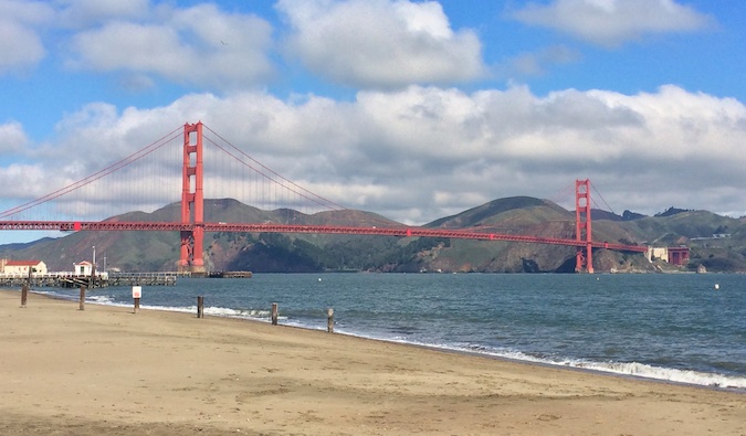 Looking up at the Golden Gate Bridge from the San Francisco Beach in the summer