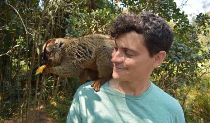 Nomadic Matt with a lemur in Madagascar