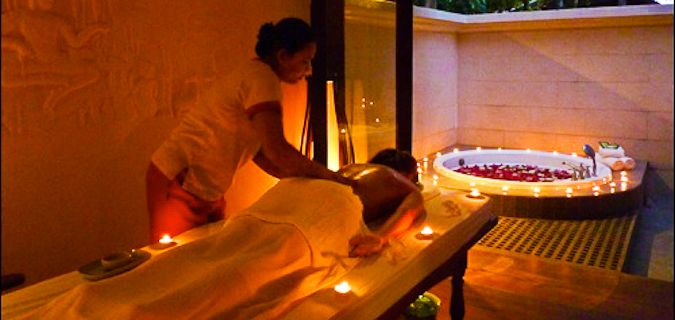A female traveler getting a romantic massage overseas