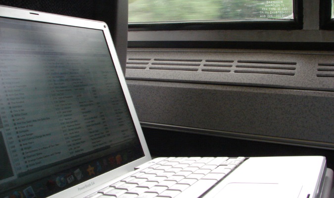 Laptop traveling on a train ride during the day overseas