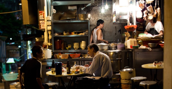 Diners eating street food in Hong Kong